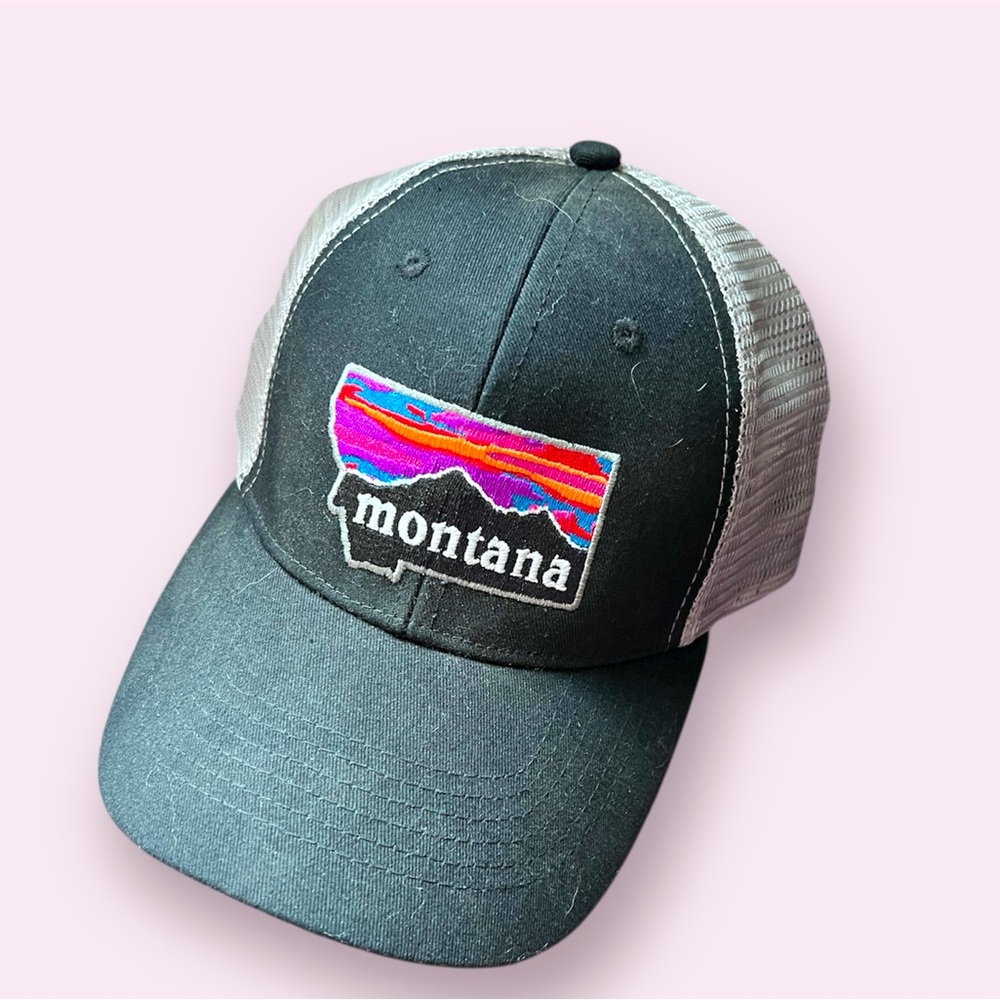 Snap back trucker hat with Montana patch. Black with grey mesh
